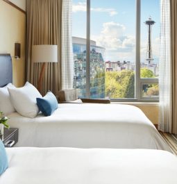 hotel room with two double beds a view of the space needle