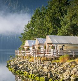 three small cottages sitting right on lake edge