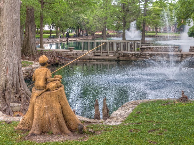 Boy and Dog Fishing Sculpture at Theta Pond on the campus of Oklahoma State University