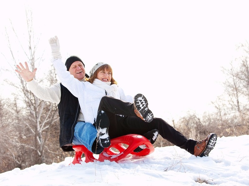 Couple sledding