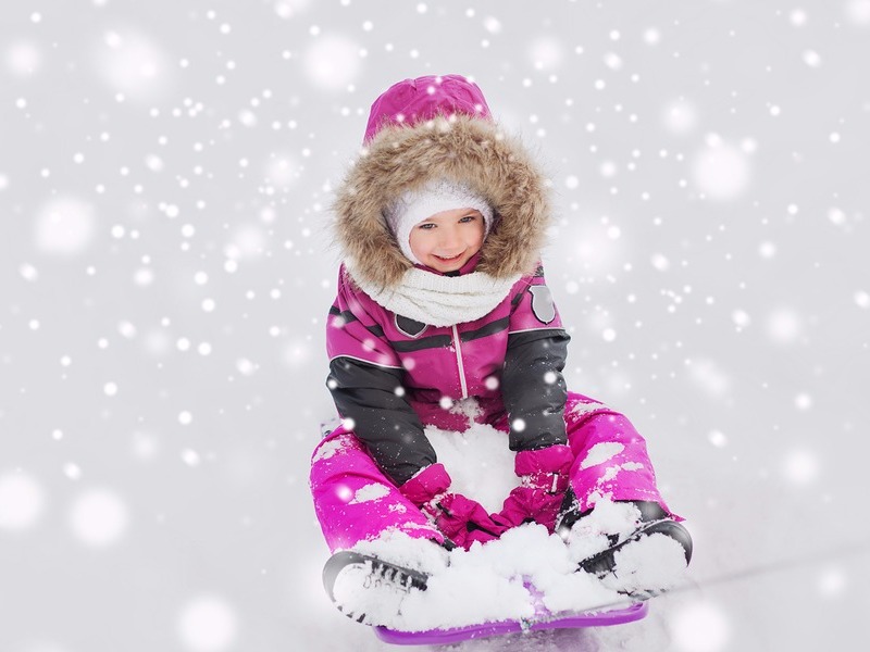 Little girl sledding