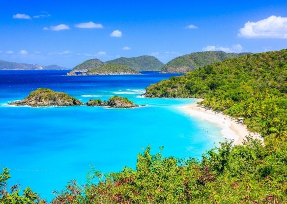 Bright turquoise waters with lush green coastline