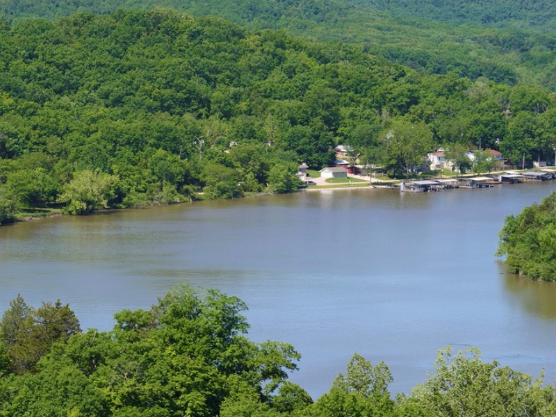 Lake of the Ozarks with boat docks and forest 