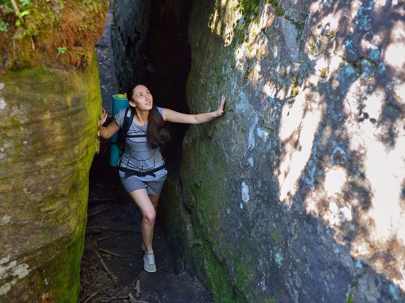 Woman exploring cave