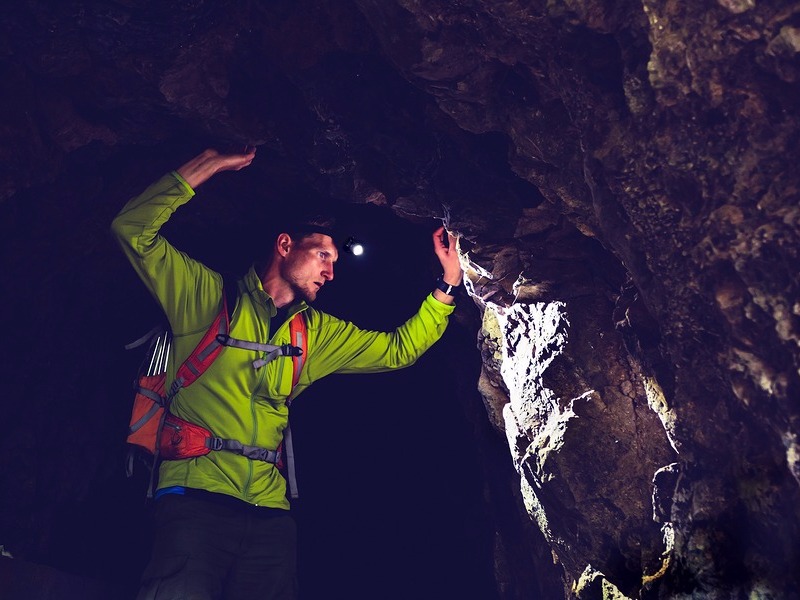 Man exploring cave