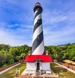 up close image of st augustine lighthouse with stripes and red roof