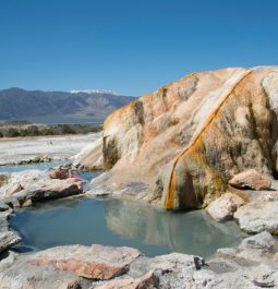 hot springs pool with a mountain backdrop