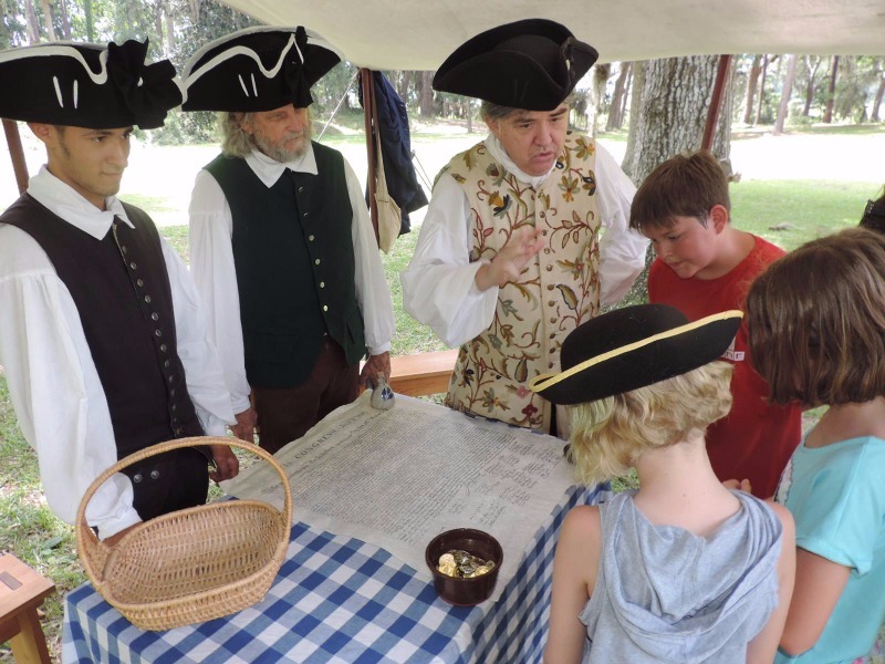 Period actors teaching children at Fort Morris Historic Site