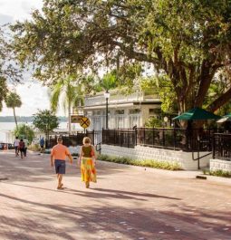 people walking along lake in mount dora