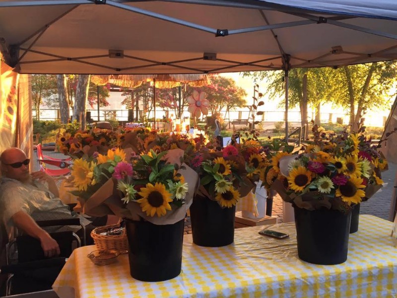 Flower for sale at a vendor booth at Saturday Market On The River