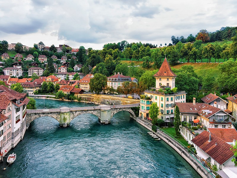 Unterbrucke bridge over Aare River and old houses in Bern Switzerland.