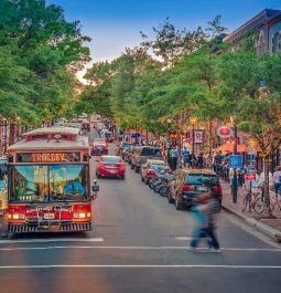 bustling street in Virginian town with people buzzing by the shops