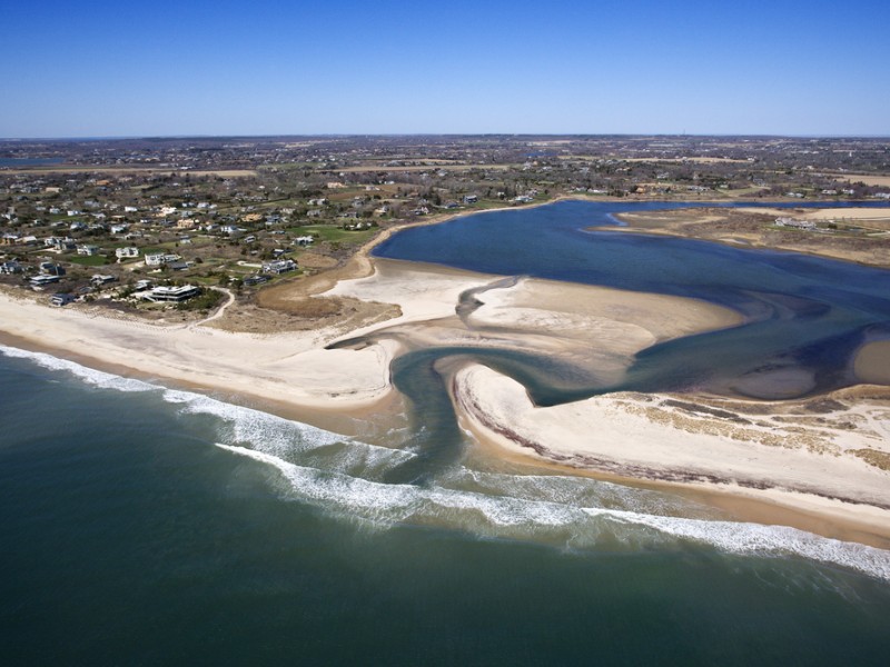 Aerial view of Southampton, New York with shoal and inlet