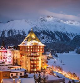 Grand hotel in middle of snow-covered mountains