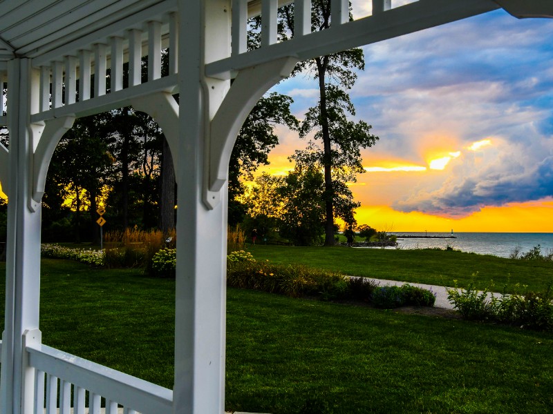 sun setting over the St Lawrence River in Trois-Rivieres, Quebec from a gazebo.