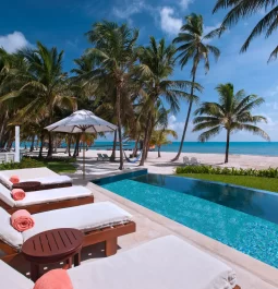 beachfront pool with sun loungers