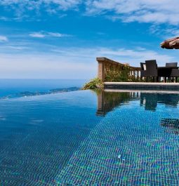 infinity pool and deck with table