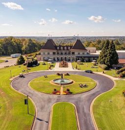 beautiful chateau situated on green rolling hills with vineyards