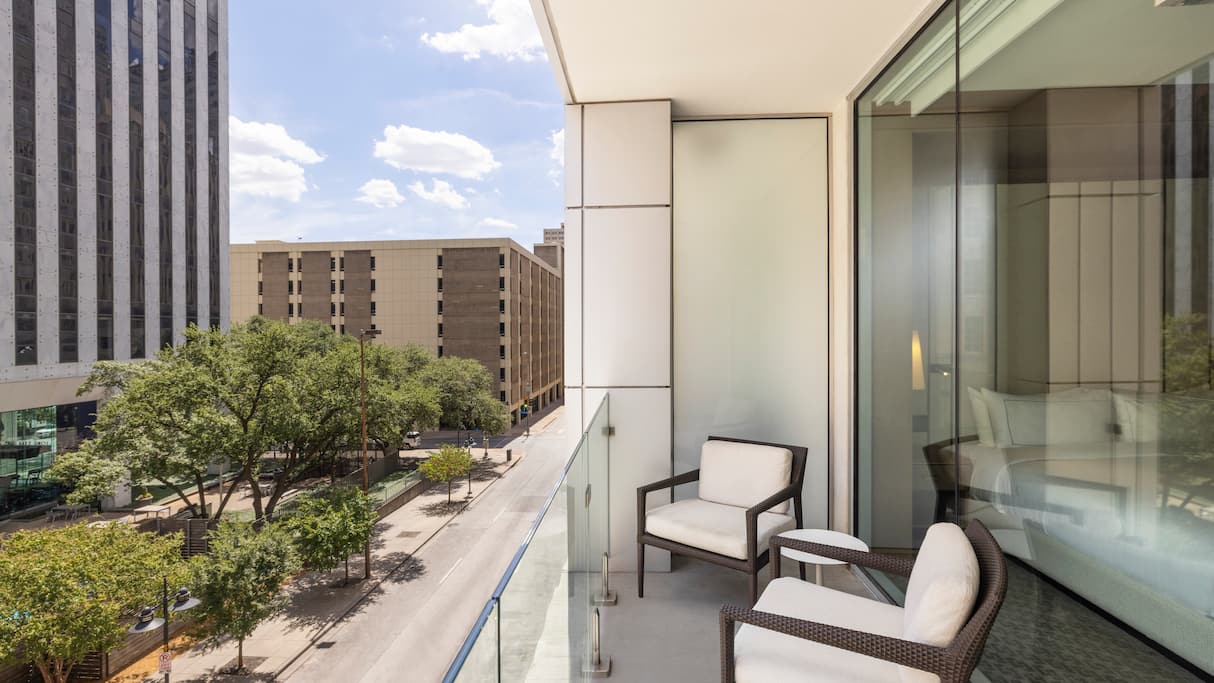 Sit on your balcony at Curio Statler Dallas