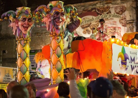 parade with orange float with krewe of boo