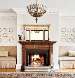 lobby of hotel with fireplace and elegant seating and decor