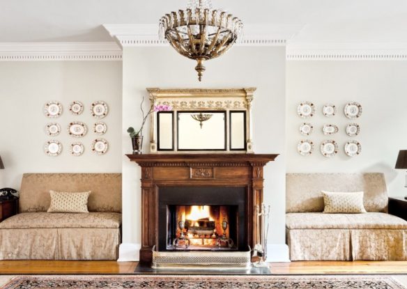 lobby of hotel with fireplace and elegant seating and decor