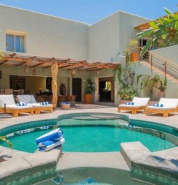 Circular plunge pool next to villa