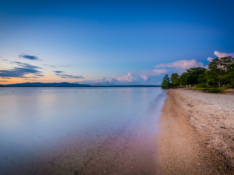 The shore of Lake Winnipesaukee at sunset, at Ellacoya State Park