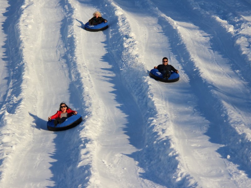 Three snow tubes down the hill