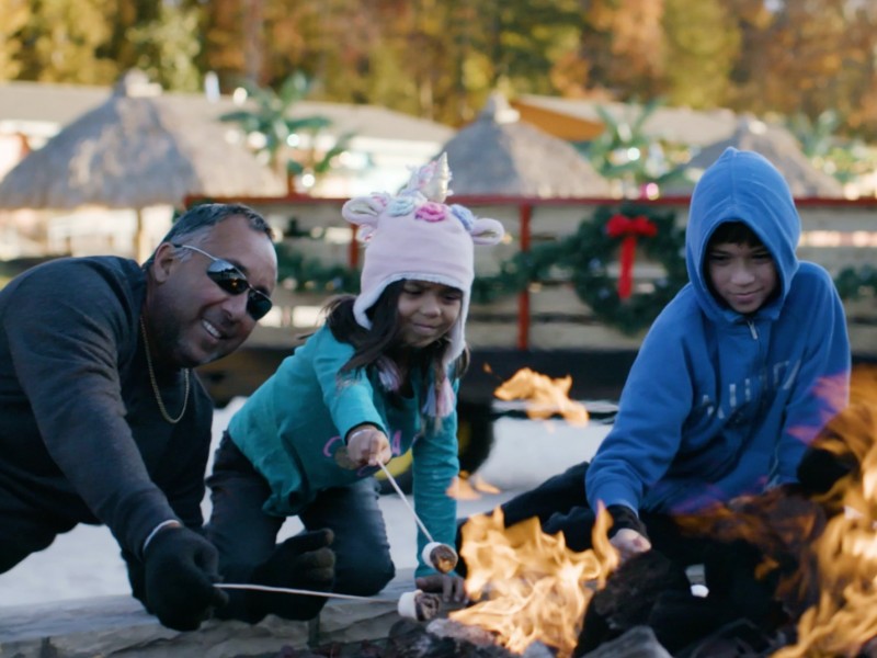 Roasting s'mores around the fire