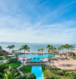 pool next to ocean and resort