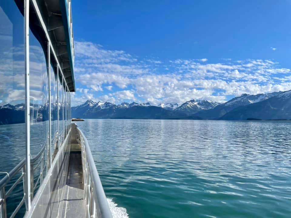 Boat cruising through the waters of Glacier Bay on Glacier Bay Tour through Glacier Bay Lodge