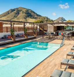 Rooftop pool at hotel with mountain nearby