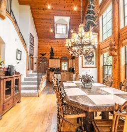 Elegant dining table beside large windows