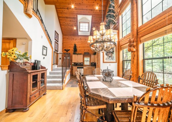 Elegant dining table beside large windows