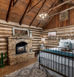 interior with stone fireplace at Cactus Log Cabin