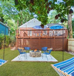 backyard area with view of patio and hammocks