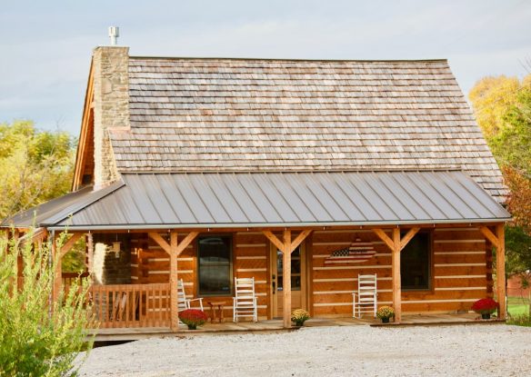 Front of cabin with rocking chairs on porch