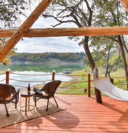 Patio scene with hammock and water view