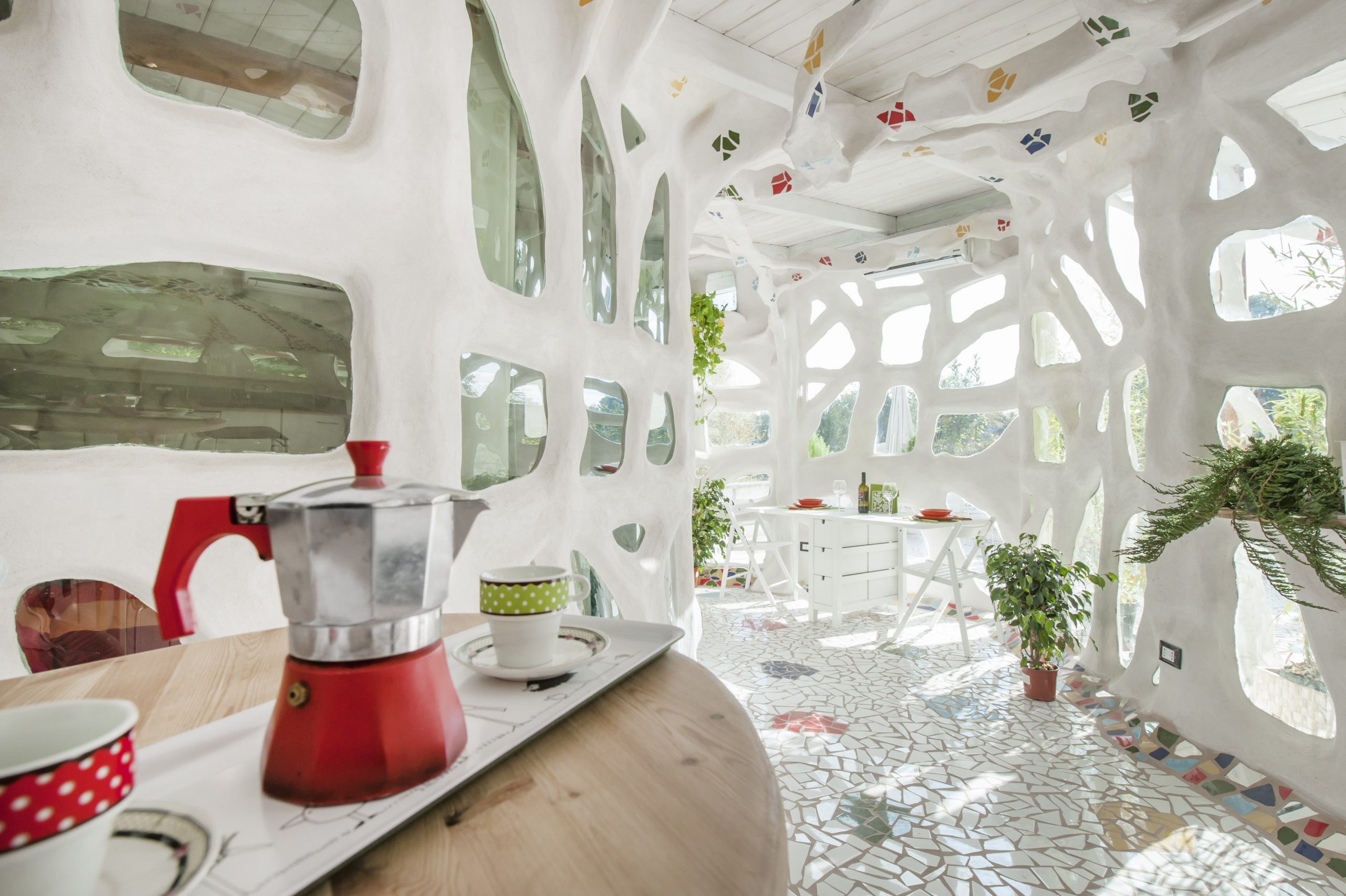 White, hole-filled interior of Rome Airbnb