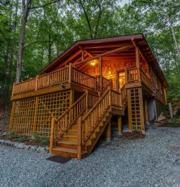 stairs leading up to glowing cabin