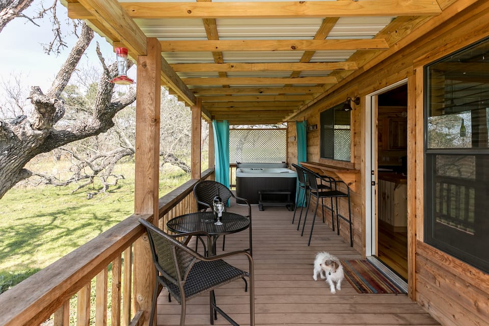 Large porch with hot tub at Nick's Cabin