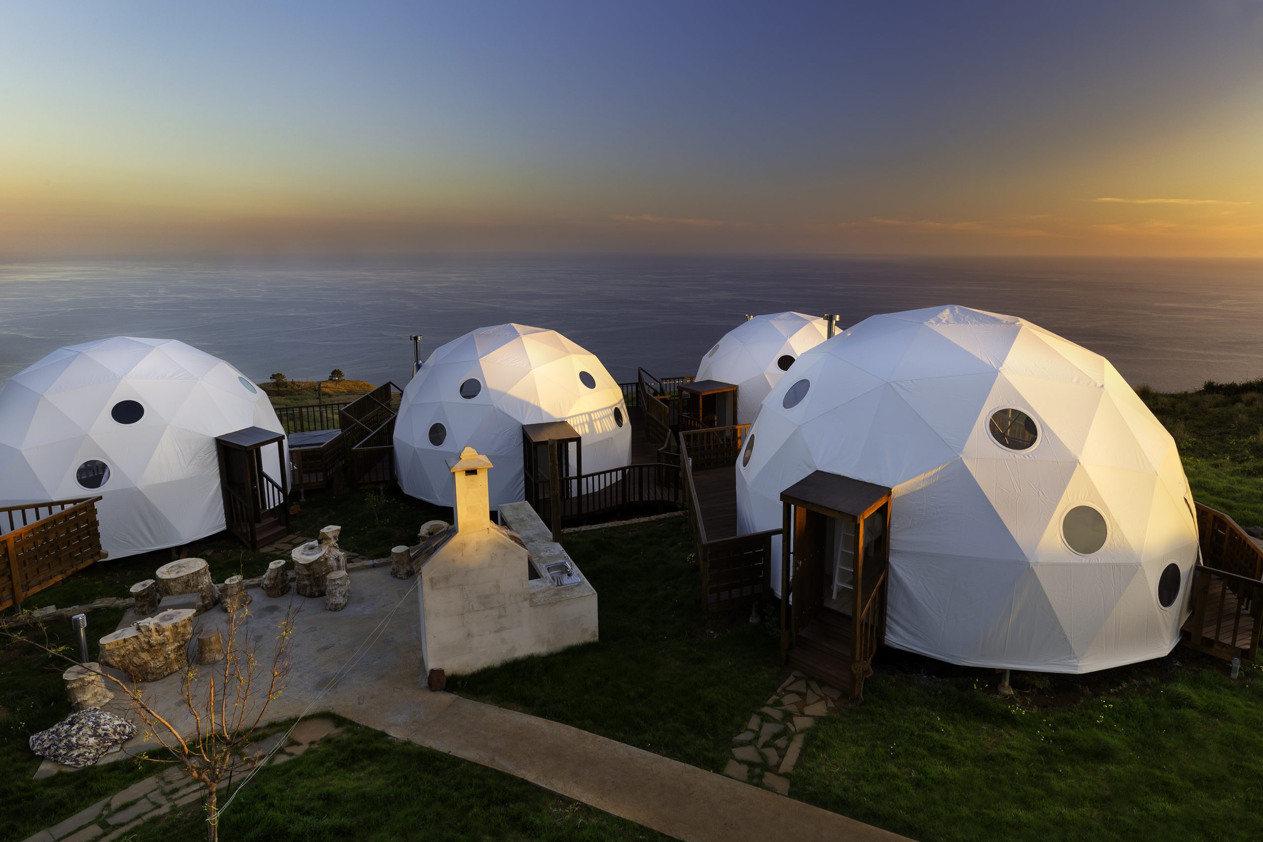 Domes overlooking the sunset and sea