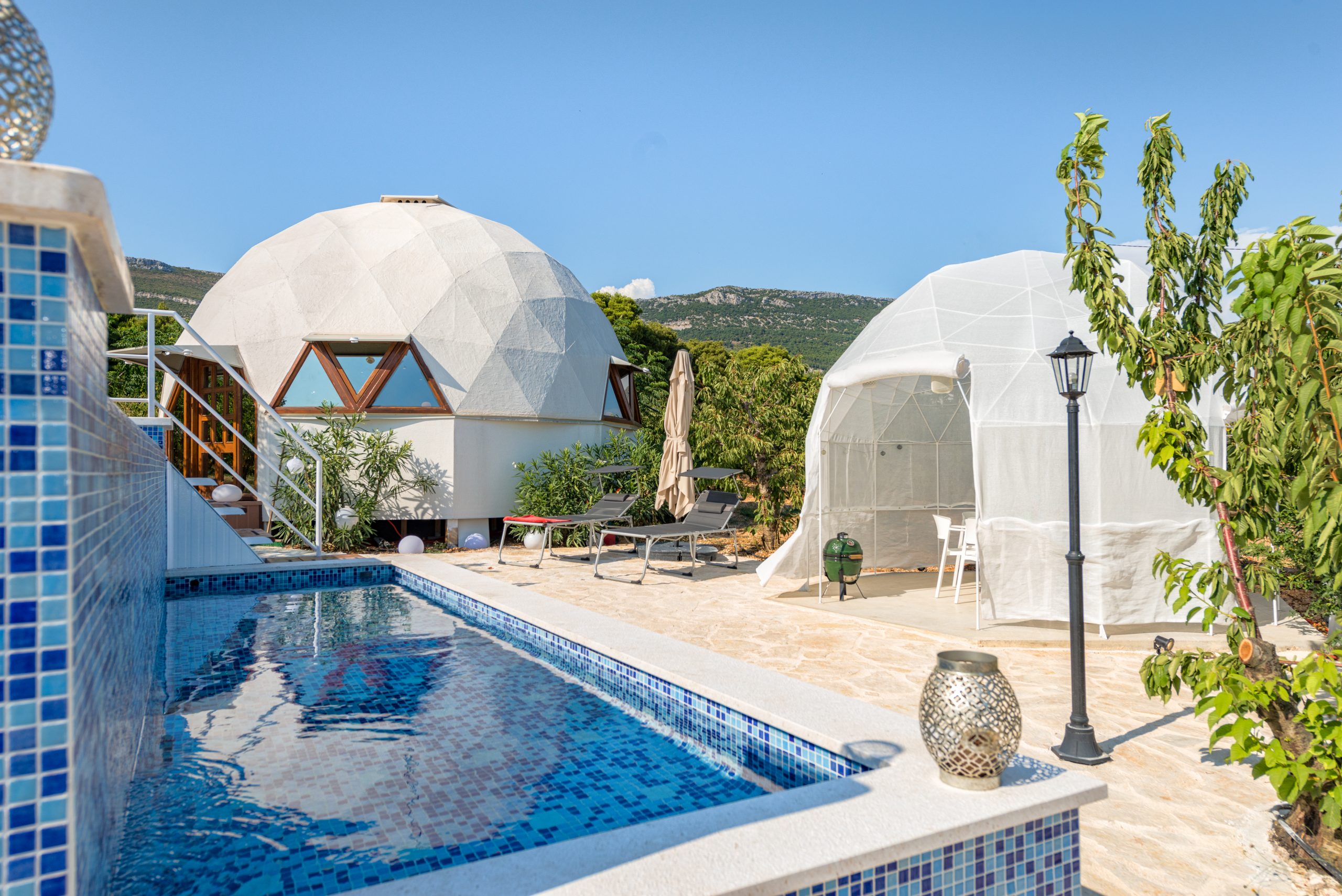 Swimming pool attached to individual domes