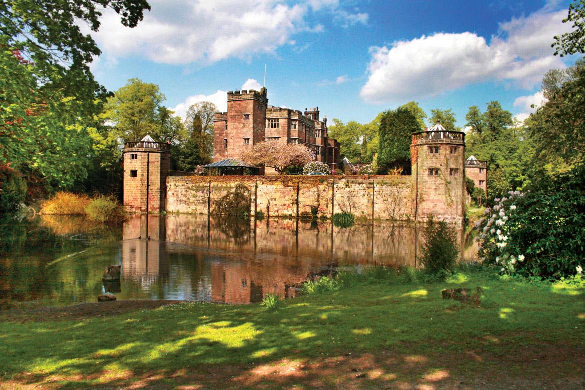 Colorful stone castle with lake in front