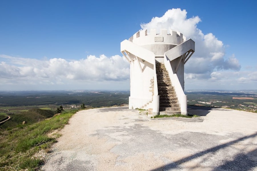 Overview of tiny White Castle building perched high on a hill