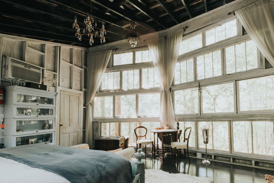 interior with wall of windows and antiques