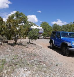 Jeep and pop-up camper at campground