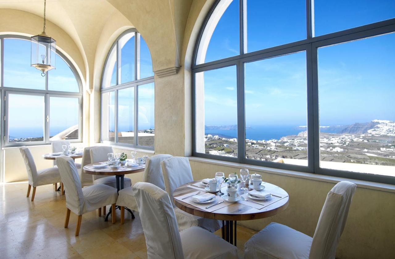 Dining area with arched windows and blue skies behind