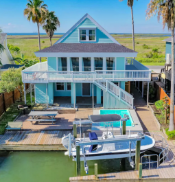 Large deck and boat outside of rental home